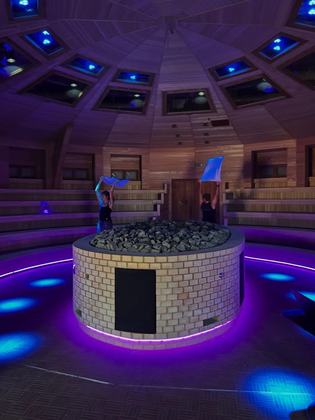 Round stove under a dome, lit in violet
